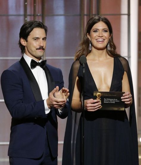 BEVERLY HILLS, CA - JANUARY 08: In this handout photo provided by NBCUniversal, presenters Milo Ventimiglia (L) and Mandy Moore onstage during the 74th Annual Golden Globe Awards at The Beverly Hilton Hotel on January 8, 2017 in Beverly Hills, California. (Photo by Paul Drinkwater/NBCUniversal via Getty Images)